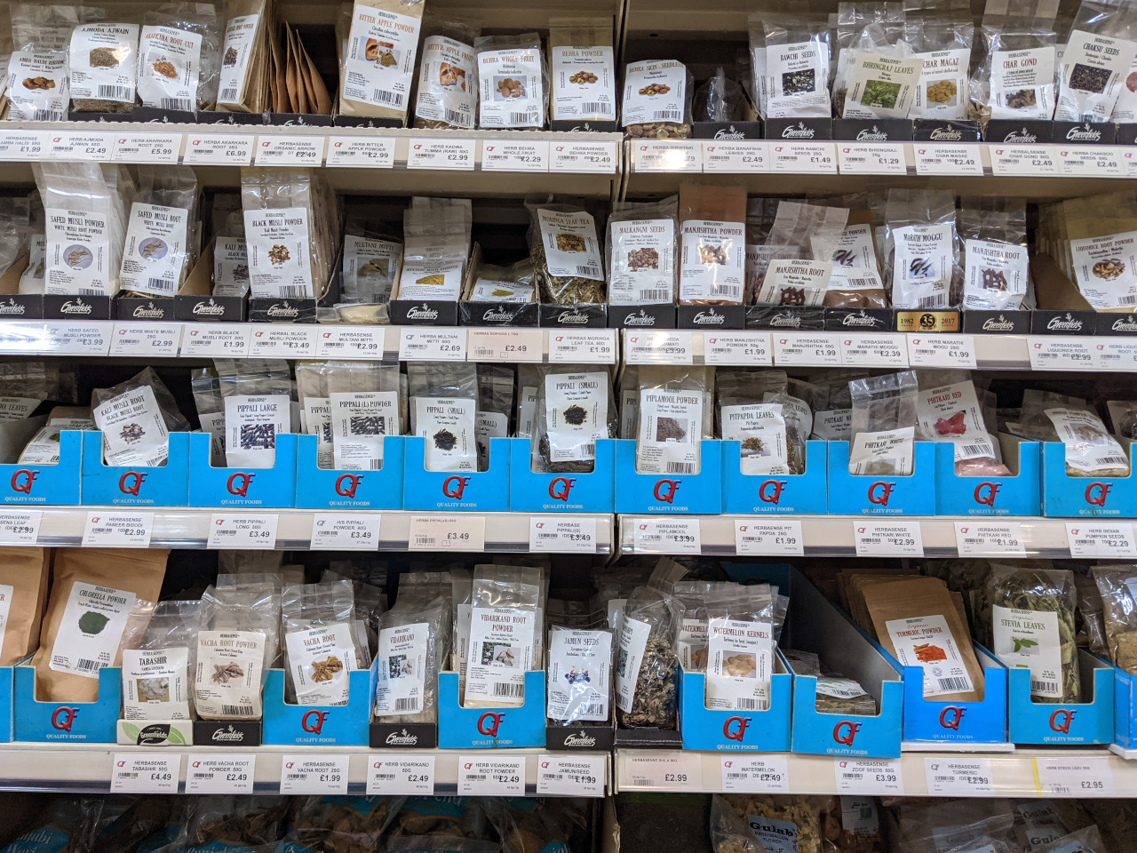 Photo of store shelves stacked with spices.